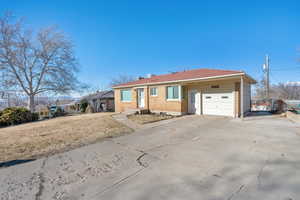 Ranch-style home featuring a garage