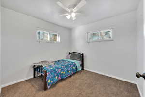 Bedroom with carpet floors and ceiling fan