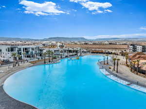 View of pool with a mountain view