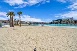 View of home's community featuring volleyball court