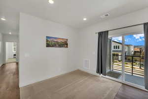 Unfurnished room featuring hardwood / wood-style floors