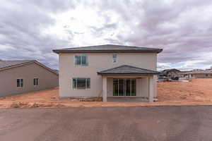 Rear view of house with a patio