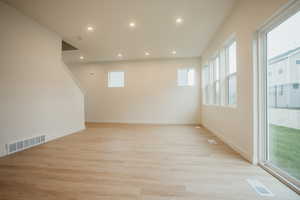 Great room with light hardwood / wood-style floors