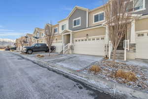 View of front of house featuring a garage and a mountain view