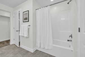 Bathroom with shower / bath combo with shower curtain