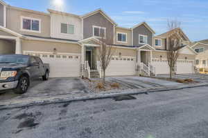 Townhome / multi-family property with a garage