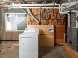 Washroom featuring washer / dryer