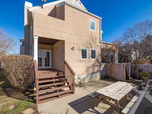 Back of property with french doors and a patio area