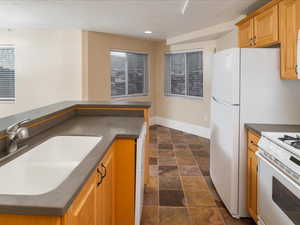 Kitchen with white range and sink