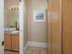 Bathroom with vanity and tile patterned floors