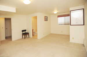 Empty room with light colored carpet