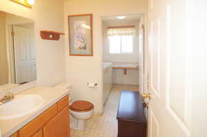 Bathroom featuring vanity and toilet