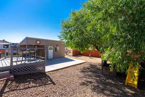 View of yard with a wooden deck