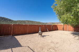 View of yard featuring a mountain view and a fire pit