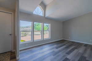 Interior space with plenty of natural light and dark hardwood / wood-style floors