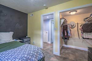 Bedroom featuring a textured ceiling