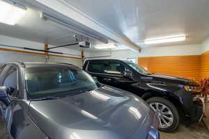 Garage featuring a garage door opener