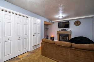 Living room featuring a textured ceiling