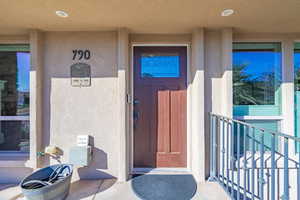 Entrance to property with a balcony