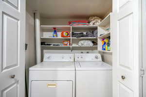 Washroom with washing machine and dryer