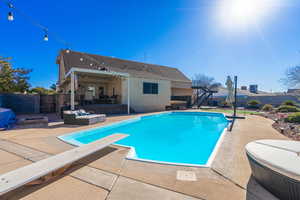 View of swimming pool featuring an outdoor living space and a patio