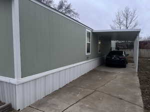 View of home's exterior with a carport