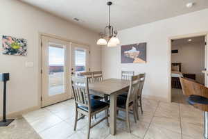 Tiled dining area with french doors