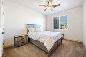 Bedroom featuring ceiling fan and carpet flooring