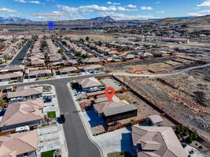 Birds eye view of property with a mountain view