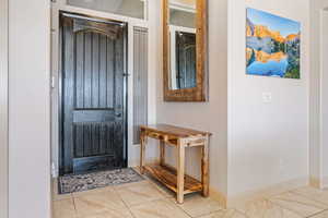 Entryway featuring tile patterned flooring