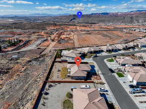 Birds eye view of property with a mountain view