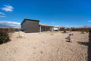 Back of property with a patio