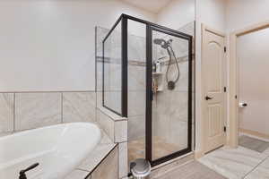 Bathroom featuring separate shower and tub