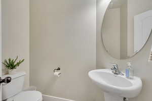 Bathroom featuring sink and toilet