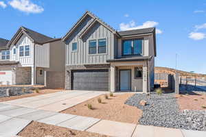 View of front facade featuring a garage