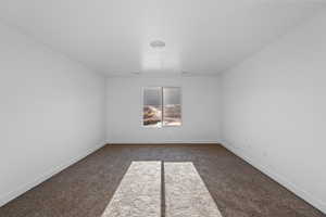 View of carpeted spare room