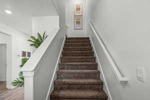 Stairway with hardwood / wood-style floors