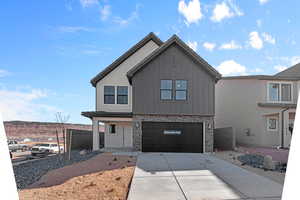 View of front facade featuring a garage