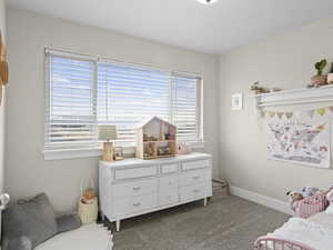 Bedroom featuring carpet flooring