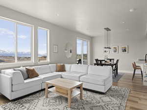 Living room featuring a mountain view and light wood-type flooring