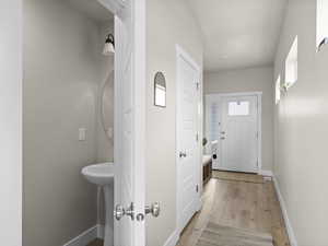 Bathroom featuring sink and hardwood / wood-style floors