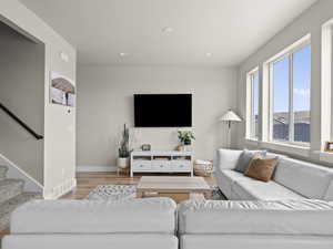 Living room with light hardwood / wood-style floors