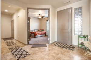 Foyer entrance with ceiling fan