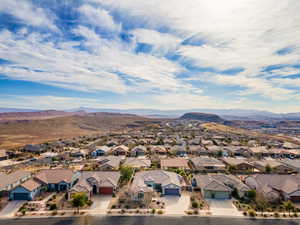 Birds eye view of property with a mountain view