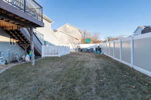 View of yard featuring wooden deck