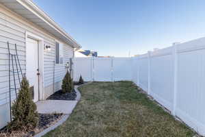 View of side yard and garage entrance