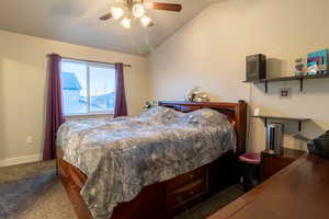 Master bedroom with ceiling fan and carpeted floor