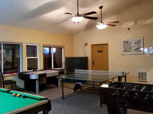 Playroom featuring pool table, vaulted ceiling, and carpet flooring