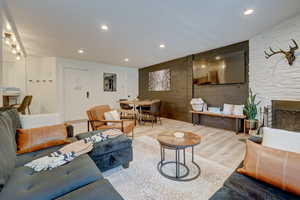 Living room featuring a fireplace and light hardwood / wood-style floors