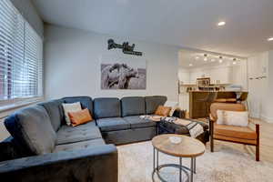 Living room with light hardwood / wood-style flooring